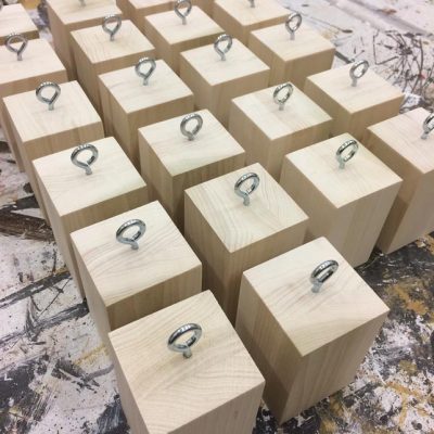 Eyebolts attached to the wood blocks